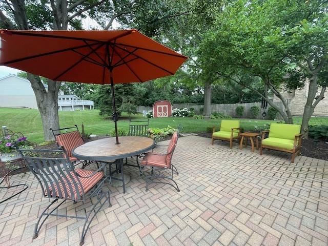 10S305 Havens Dr, Downers Grove, IL 60516 - view of patio / terrace featuring a storage shed and outdoor dining space