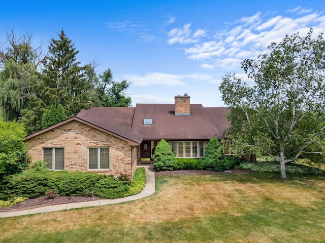 35W186 Duchesne Dr, Dundee, IL 60118 - cape cod-style house with a front lawn, brick siding, a chimney, and a shingled roof