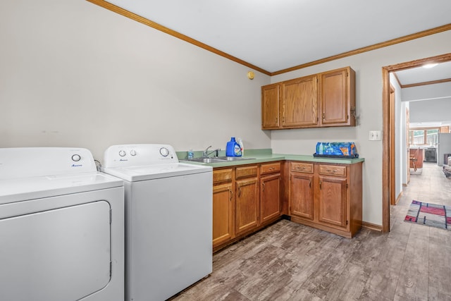 35W186 Duchesne Dr, Dundee, IL 60118 - laundry area with ornamental molding, cabinet space, independent washer and dryer, and light wood finished floors