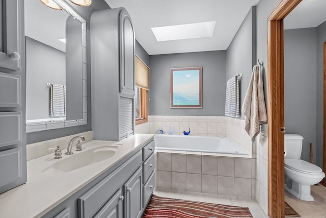 35W186 Duchesne Dr, Dundee, IL 60118 - full bathroom featuring a skylight, vanity, a bath, and tile patterned floors