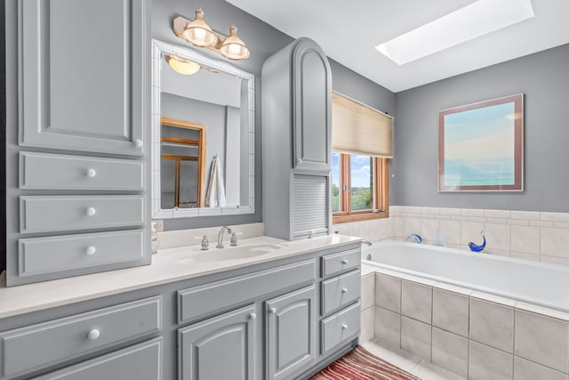 35W186 Duchesne Dr, Dundee, IL 60118 - bathroom featuring a skylight, vanity, and a garden tub