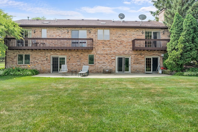 35W186 Duchesne Dr, Dundee, IL 60118 - back of house featuring a balcony, a patio, a lawn, and a chimney