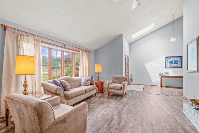 35W186 Duchesne Dr, Dundee, IL 60118 - living room with a skylight, wood finished floors, high vaulted ceiling, and a textured ceiling