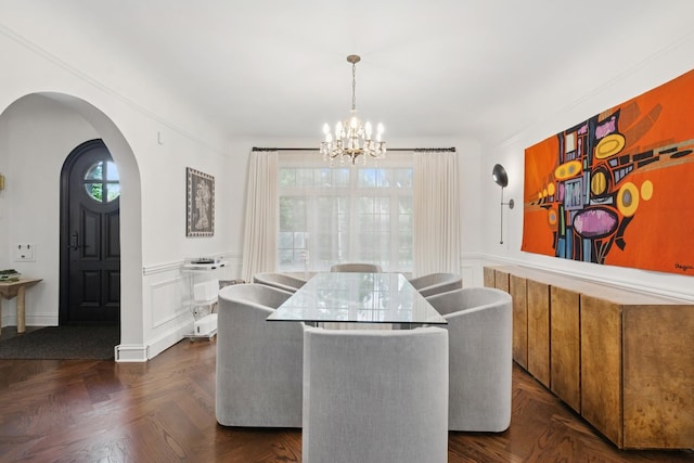 3045 W Ardmore Ave, Chicago, IL 60659 - dining room with a chandelier, arched walkways, wainscoting, and a decorative wall