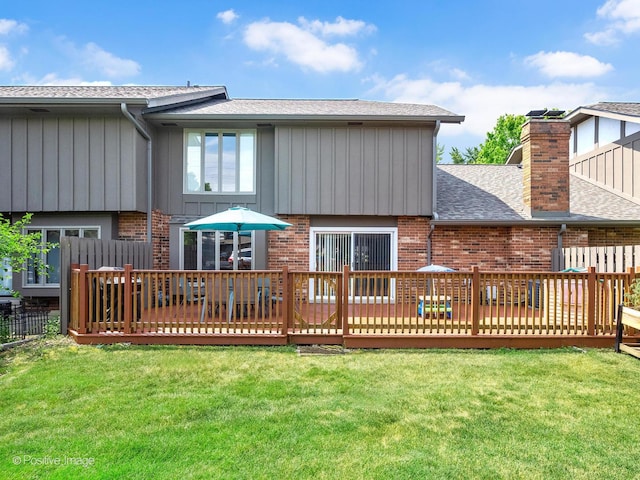 8228 W 140th St Unit 8228, Orland Park, IL 60462 - rear view of house featuring brick siding, a deck, roof with shingles, and board and batten siding