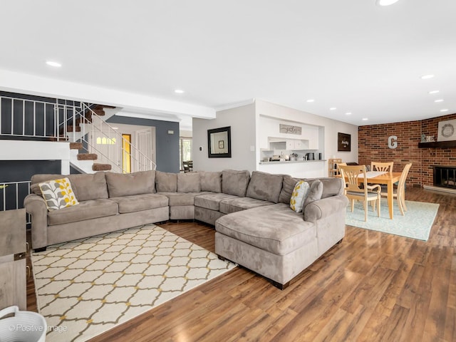 8228 W 140th St Unit 8228, Orland Park, IL 60462 - living room with wood finished floors, recessed lighting, stairway, and a brick fireplace