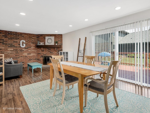 8228 W 140th St Unit 8228, Orland Park, IL 60462 - dining room featuring recessed lighting, a brick fireplace, wood finished floors, and brick wall