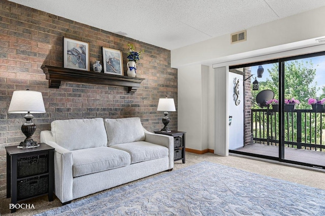 1423 Woodbridge Rd Unit 2C, Joliet, IL 60436 - living area featuring carpet floors, a textured ceiling, and brick wall