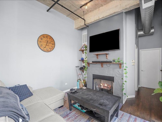 758 N Larrabee St Unit 826, Chicago, IL 60610 - living room with a fireplace, wood finished floors, and rail lighting