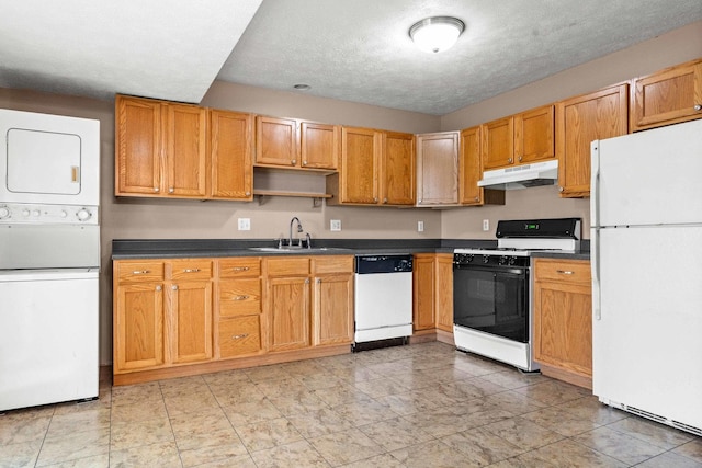 23 Fetzer Dr Unit 3, Bloomington, IL 61704 - kitchen with white appliances, under cabinet range hood, stacked washer and clothes dryer, dark countertops, and open shelves
