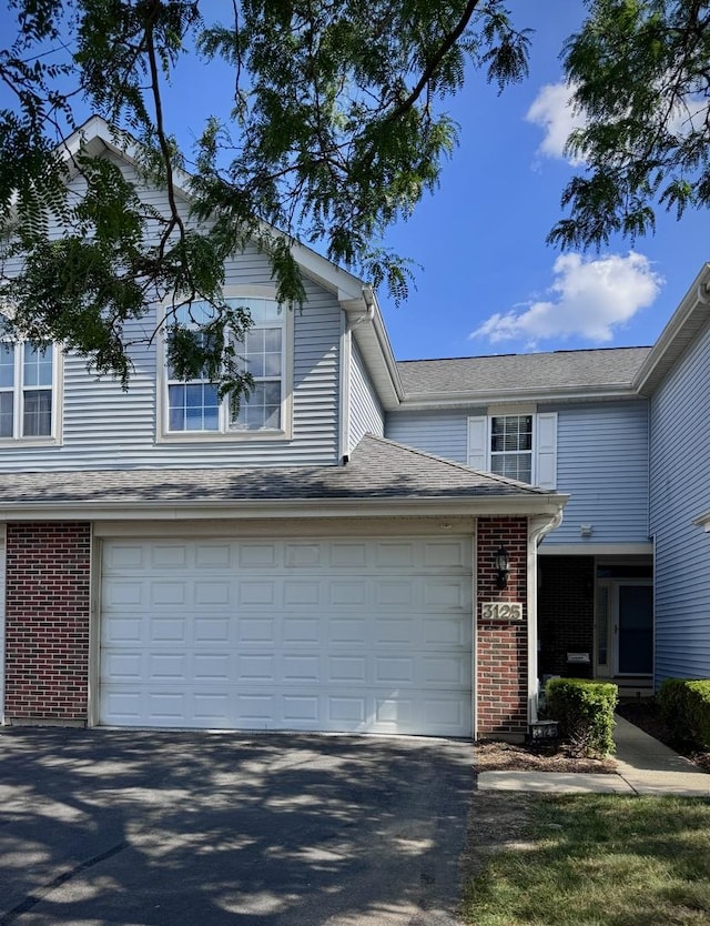 3125 Anton Dr Unit 3125, Aurora, IL 60504 - traditional home featuring brick siding and asphalt driveway