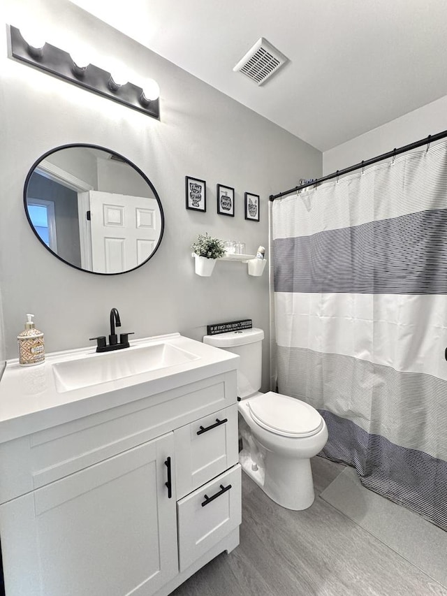 3125 Anton Dr Unit 3125, Aurora, IL 60504 - full bathroom featuring vanity and wood finished floors