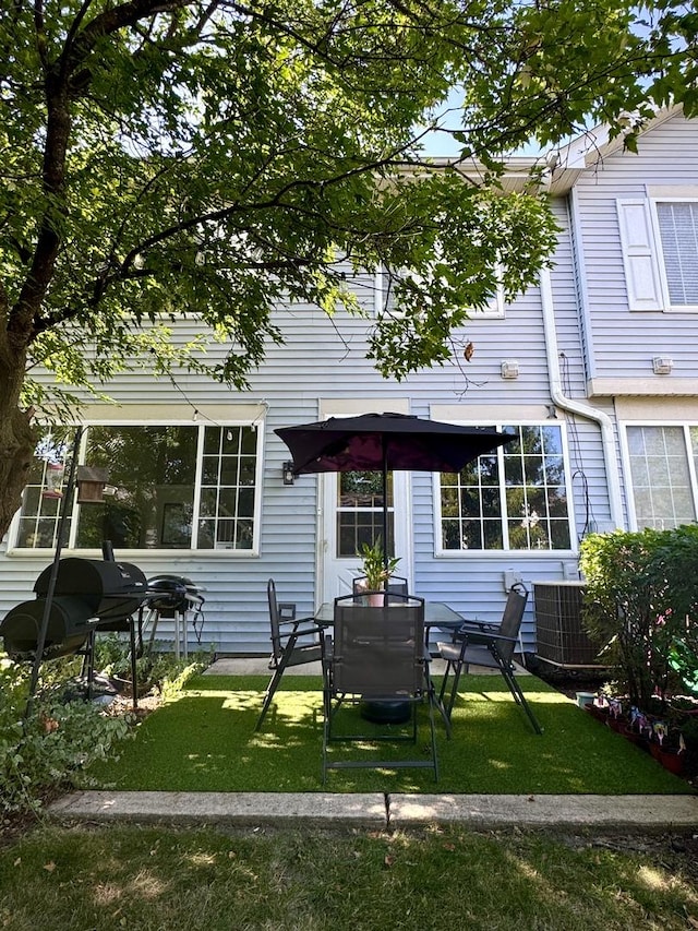 3125 Anton Dr Unit 3125, Aurora, IL 60504 - back of property featuring a lawn