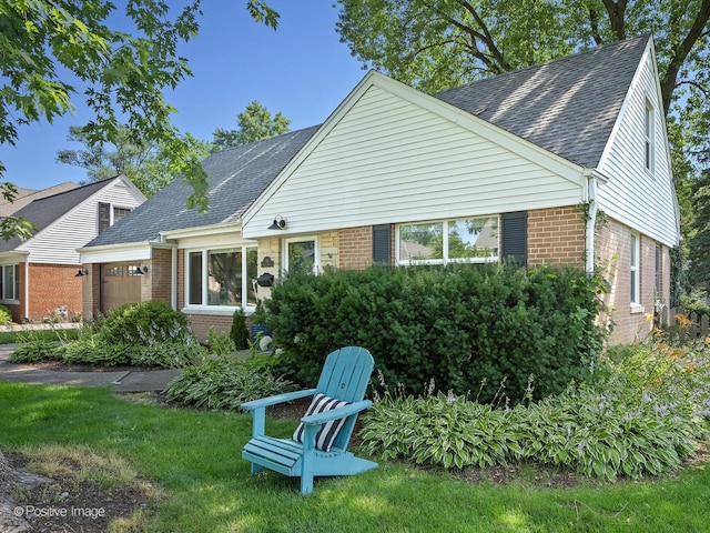 19 Indian Dr, Clarendon Hills, IL 60514 - view of front of property with brick siding, a shingled roof, an attached garage, and a front lawn