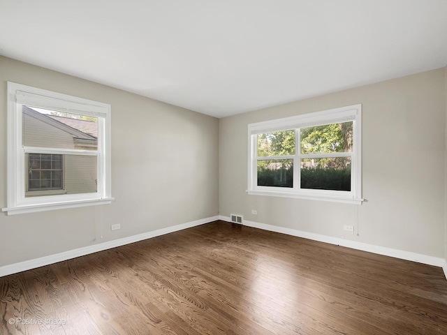 19 Indian Dr, Clarendon Hills, IL 60514 - spare room with healthy amount of natural light and dark wood-type flooring