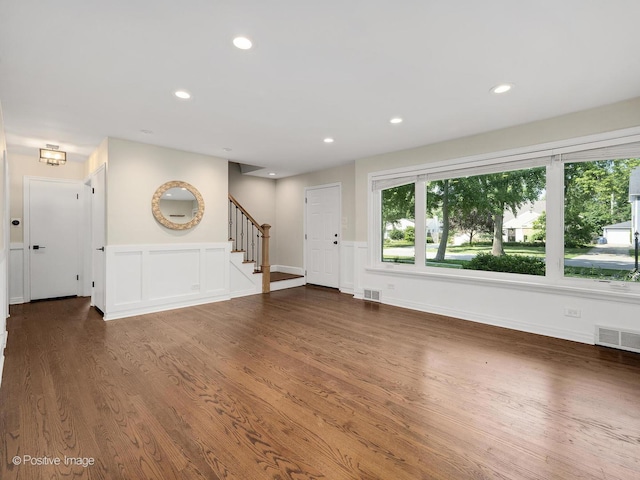 19 Indian Dr, Clarendon Hills, IL 60514 - unfurnished living room featuring wood finished floors, stairway, recessed lighting, and a wainscoted wall