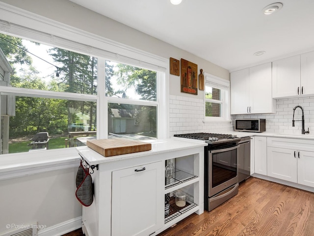 19 Indian Dr, Clarendon Hills, IL 60514 - kitchen with stainless steel appliances, tasteful backsplash, white cabinets, light countertops, and recessed lighting