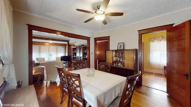 442 Hannah Ave, Forest Park, IL 60130 - dining room featuring a ceiling fan, wood finished floors, and crown molding