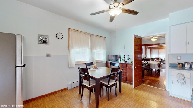 442 Hannah Ave, Forest Park, IL 60130 - dining room with a baseboard radiator, a ceiling fan, and plenty of natural light