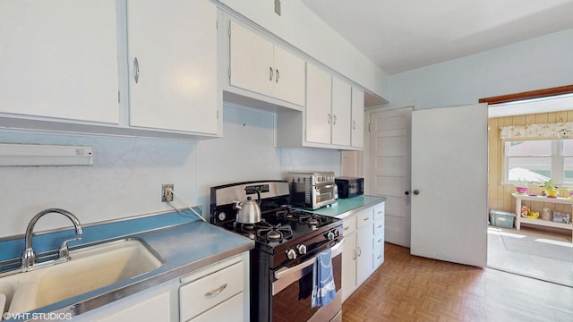 442 Hannah Ave, Forest Park, IL 60130 - kitchen featuring gas stove and white cabinets