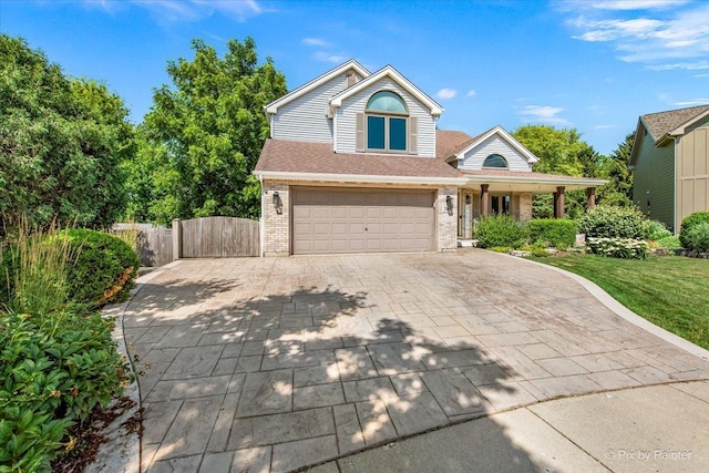 746 Parker Ct, Geneva, IL 60134 - traditional home featuring brick siding, an attached garage, driveway, roof with shingles, and a gate