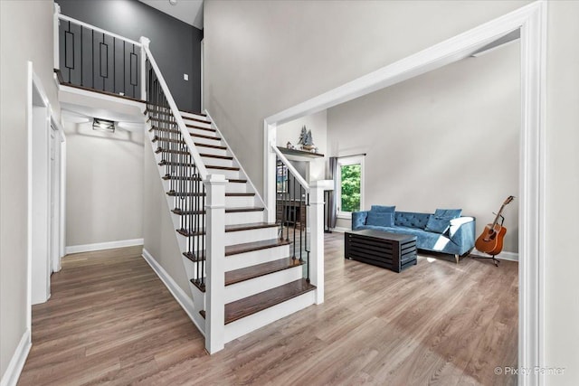 746 Parker Ct, Geneva, IL 60134 - staircase featuring wood finished floors and a high ceiling