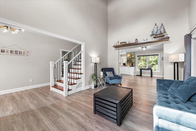 746 Parker Ct, Geneva, IL 60134 - living area featuring stairway, wood finished floors, and a high ceiling