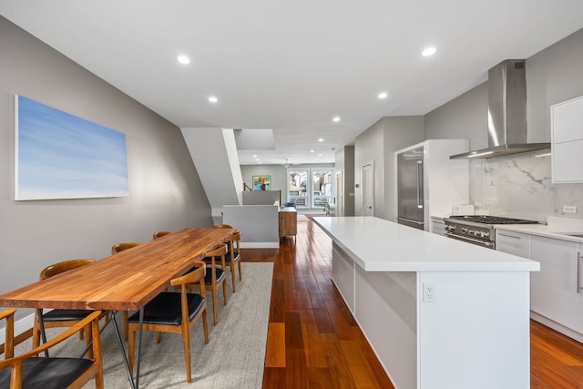 1123 W 19th St, Chicago, IL 60608 - kitchen with wall chimney exhaust hood, modern cabinets, high end range, a kitchen island, and recessed lighting