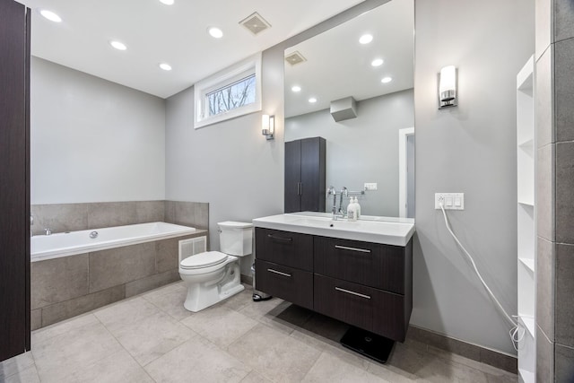 1123 W 19th St, Chicago, IL 60608 - full bathroom featuring tiled bath, vanity, recessed lighting, and tile patterned flooring