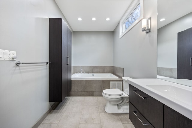 1123 W 19th St, Chicago, IL 60608 - full bathroom featuring a garden tub, vanity, recessed lighting, and tile patterned floors
