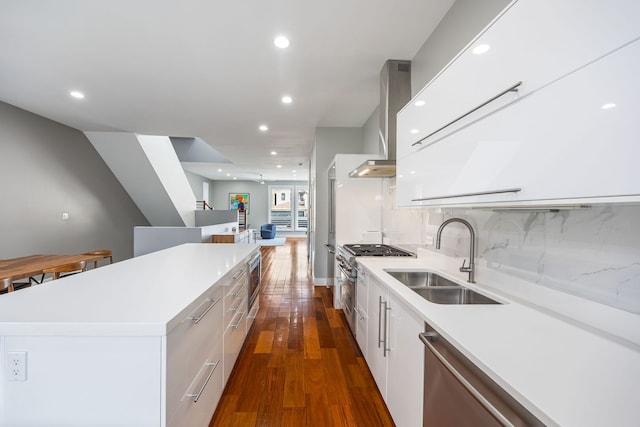 1123 W 19th St, Chicago, IL 60608 - kitchen with modern cabinets, wall chimney range hood, a kitchen island, appliances with stainless steel finishes, and dark wood-style flooring