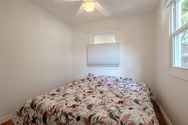 712 Fremont St, Bloomington, IL 61701 - bedroom featuring multiple windows, a ceiling fan, and wood finished floors