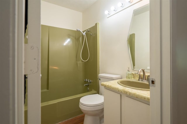 712 Fremont St, Bloomington, IL 61701 - full bathroom featuring tub / shower combination, vanity, and wood finished floors