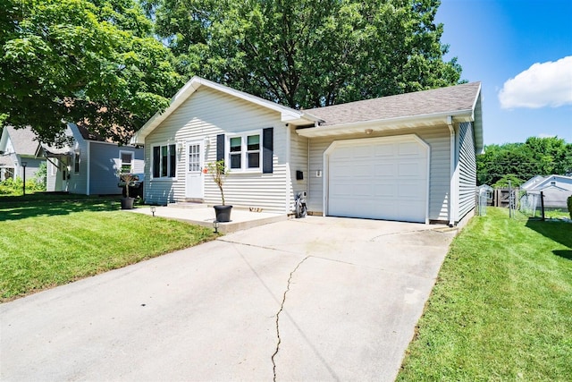 712 Fremont St, Bloomington, IL 61701 - view of front facade featuring an attached garage, driveway, and roof with shingles