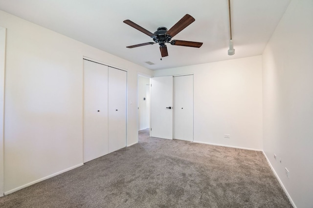 808 S Cedarcrest Dr, Schaumburg, IL 60193 - unfurnished bedroom featuring carpet floors, two closets, and a ceiling fan