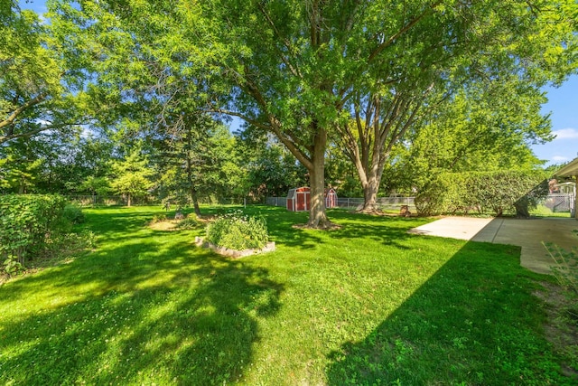 808 S Cedarcrest Dr, Schaumburg, IL 60193 - fenced backyard with a patio and a storage unit