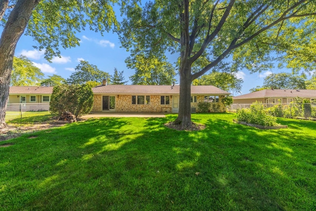 808 S Cedarcrest Dr, Schaumburg, IL 60193 - view of front of home featuring stone siding, a chimney, and a patio