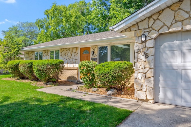808 S Cedarcrest Dr, Schaumburg, IL 60193 - view of front facade featuring stone siding, a garage, a front lawn, and a shingled roof