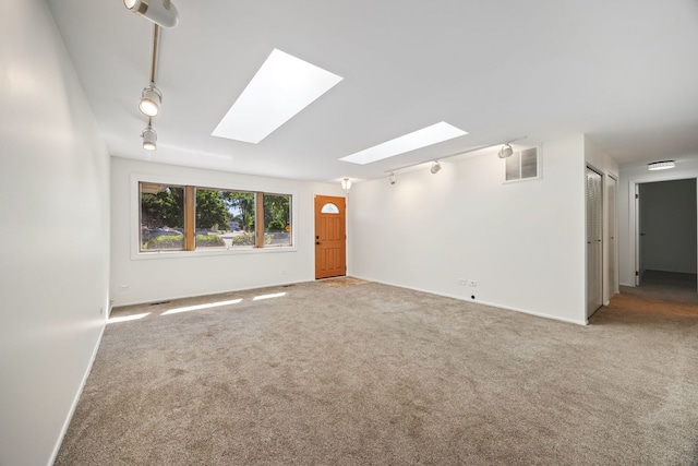 808 S Cedarcrest Dr, Schaumburg, IL 60193 - carpeted empty room with a skylight and track lighting