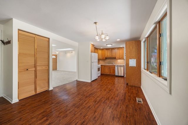 808 S Cedarcrest Dr, Schaumburg, IL 60193 - kitchen featuring white appliances, dark wood-type flooring, a chandelier, decorative backsplash, and light countertops
