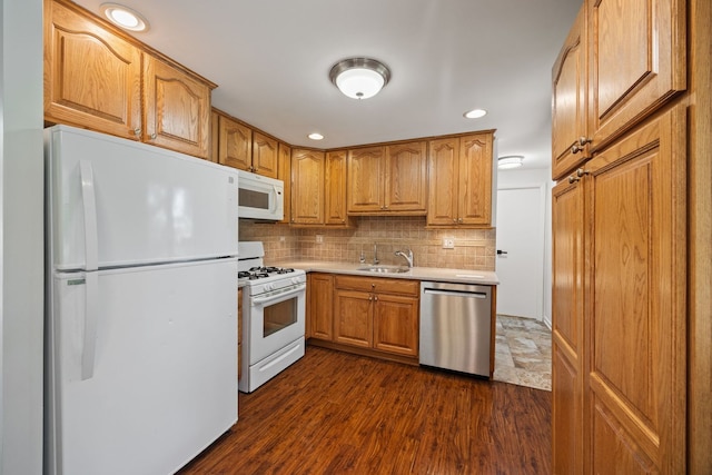 808 S Cedarcrest Dr, Schaumburg, IL 60193 - kitchen featuring white appliances, backsplash, light countertops, dark wood-style floors, and recessed lighting