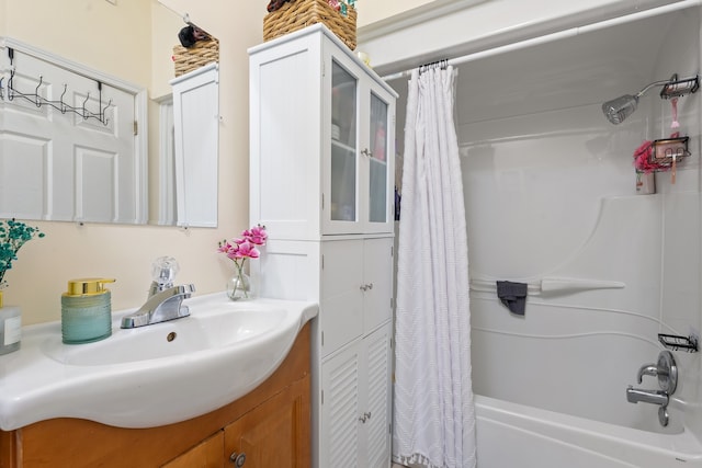 4424 S University Ave, Chicago, IL 60653 - bathroom featuring shower / bath combo with shower curtain and vanity