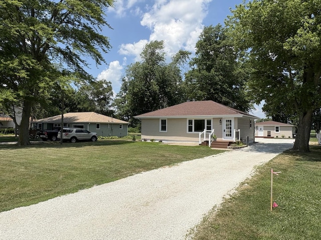 5101 W 1000 N Rd, Kankakee, IL 60901 - view of front of house with a front lawn and gravel driveway