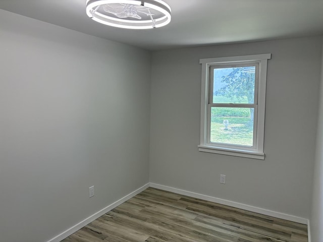 5101 W 1000 N Rd, Kankakee, IL 60901 - unfurnished room with wood finished floors and a chandelier