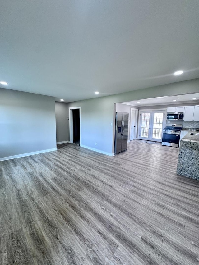 5101 W 1000 N Rd, Kankakee, IL 60901 - unfurnished living room with wood finished floors and recessed lighting