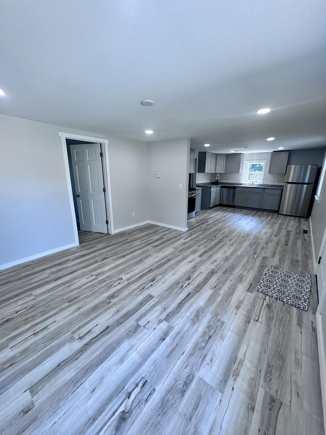 5101 W 1000 N Rd, Kankakee, IL 60901 - unfurnished living room with light wood-style floors and recessed lighting