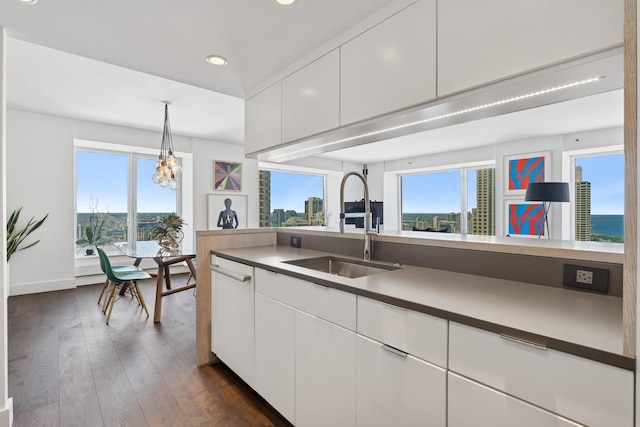 161 E Chicago Ave Unit 31F, Chicago, IL 60611 - kitchen with recessed lighting, white cabinetry, dark wood-style floors, decorative light fixtures, and a chandelier