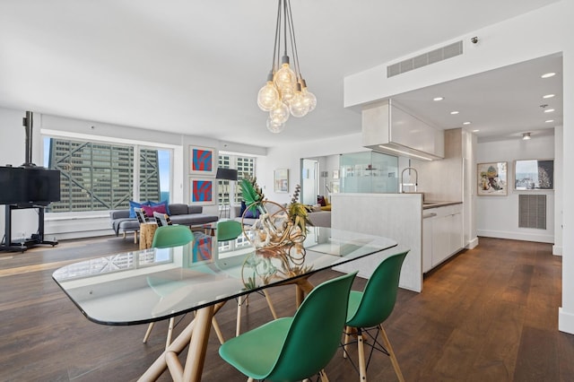 161 E Chicago Ave Unit 31F, Chicago, IL 60611 - dining space featuring dark wood finished floors, a chandelier, and recessed lighting
