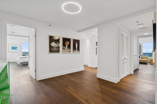 161 E Chicago Ave Unit 31F, Chicago, IL 60611 - hallway featuring dark wood-type flooring and baseboards