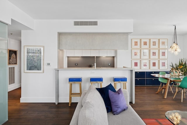 161 E Chicago Ave Unit 31F, Chicago, IL 60611 - living room featuring wood finished floors and a chandelier